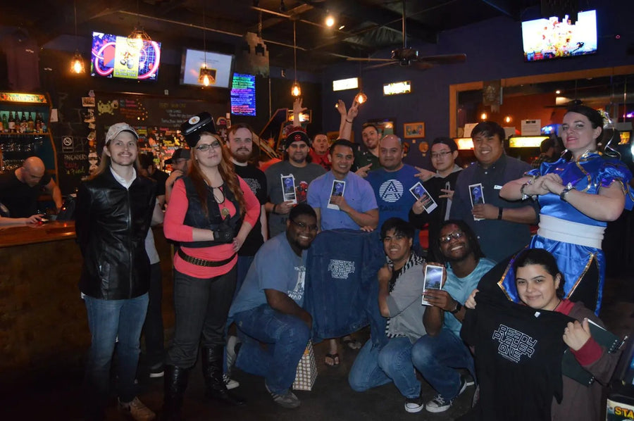 Large NerdBrew community group photo at a bar